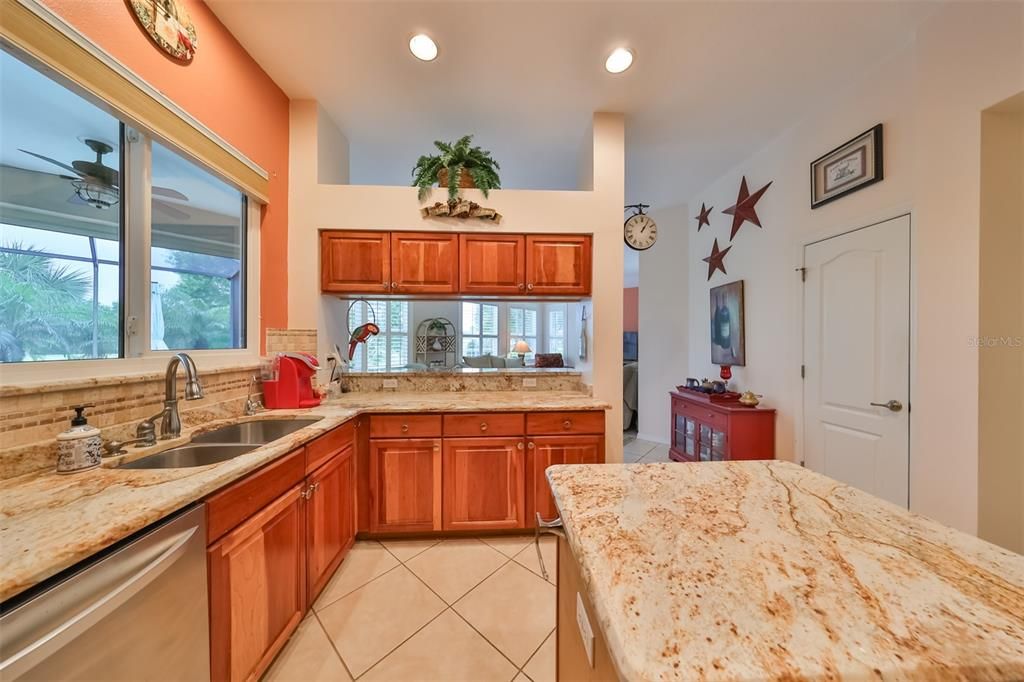 Kitchen overlooks the pool, the golf course and family room, so you are always in the middle of the fun.