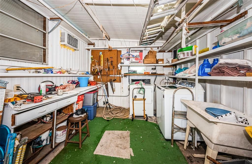 Storage area with washer/dryer