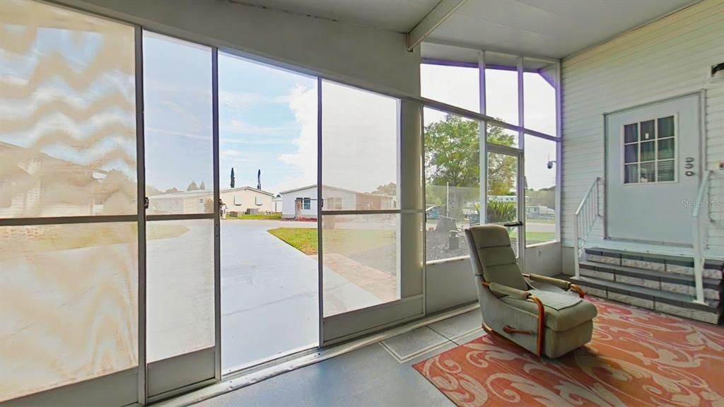 Screened door to the car port