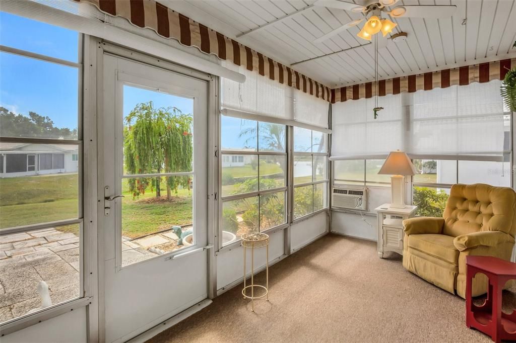 Mentioned the lanai earlier so here we are. What a wonderful view! Room AC to keep it comfortable along with overhead fan. Access door to rear patio.
