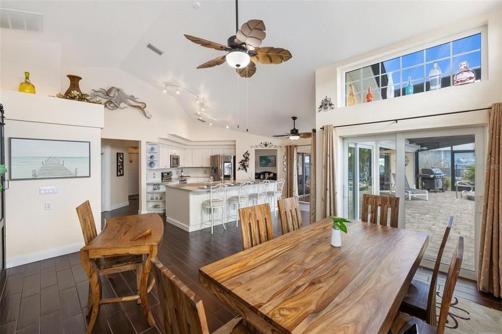easy transition from the kitchen and dining room to enjoy an expanded covered lanai overlooking the Myakka River