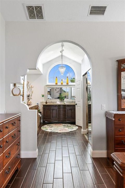 A Rutenberg custom feature arched entrance with crafted cut out niche