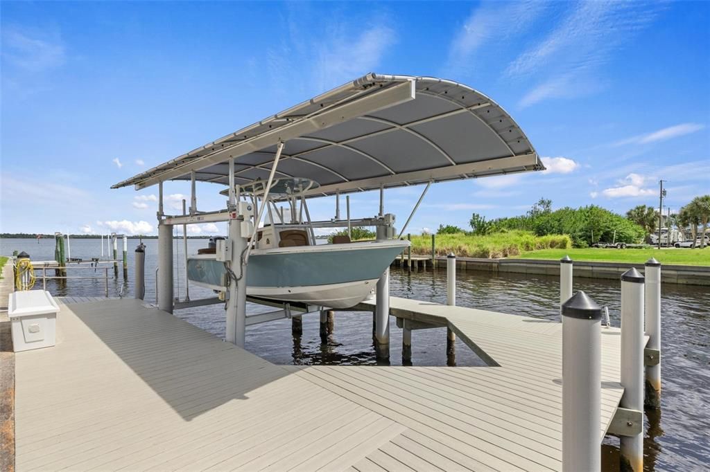 Equipped with a 25-foot 10,000# Cuda Gear Drive Boat Lift with remotes and a