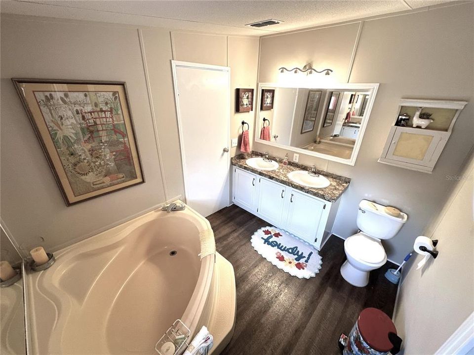 Primary bathroom showing garden tub and dual sink