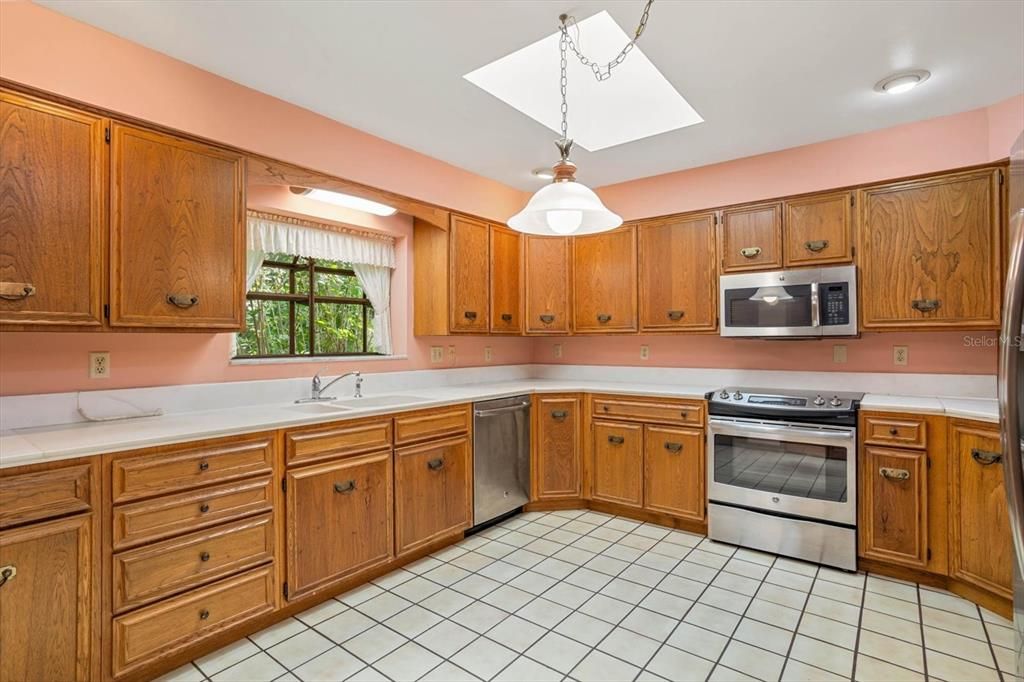 Enjoy this spacious kitchen with skylights