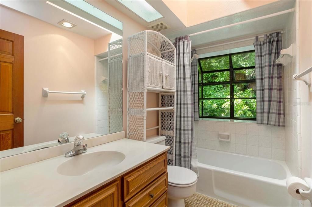 Secondary bath in great condition continues the theme of bright, open spaces with skylights, large windows and light.