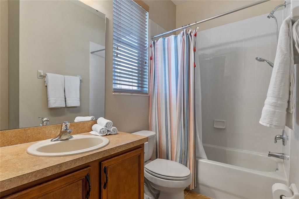 Full bathroom downstairs, with exterior door that can double as a "pool bathroom"