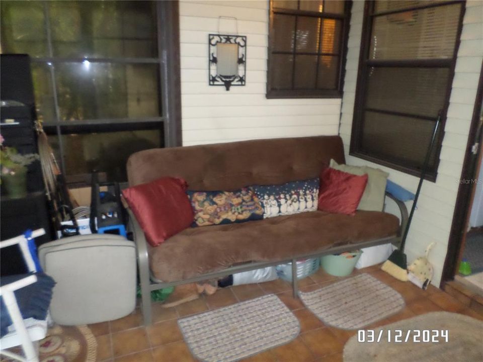 Rear porch with futon.