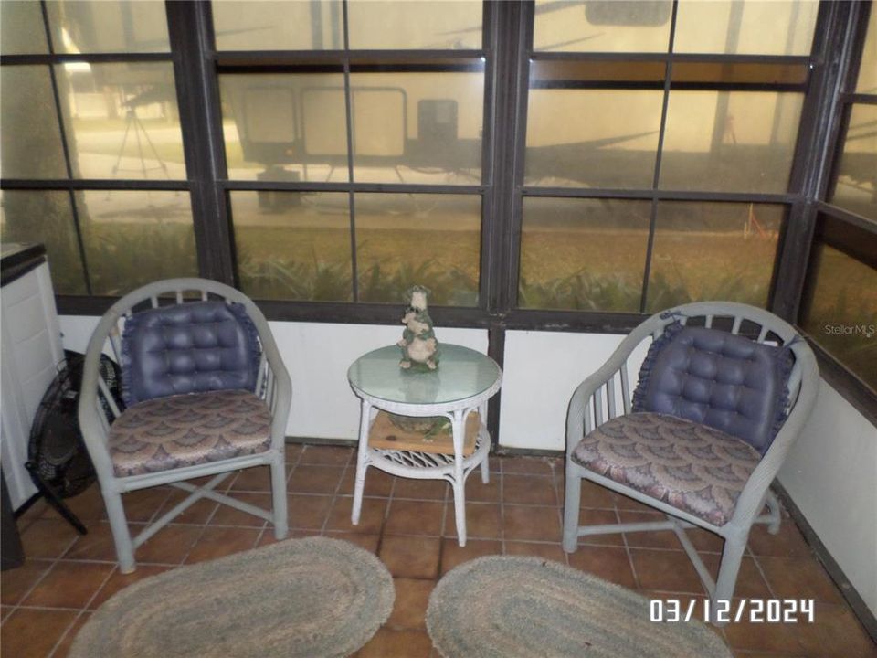 Additional seating on back porch.