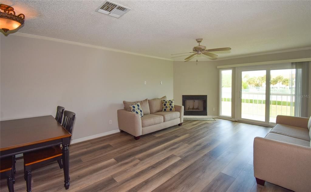 Great room- sliding glass doors to balcony and corner fireplace