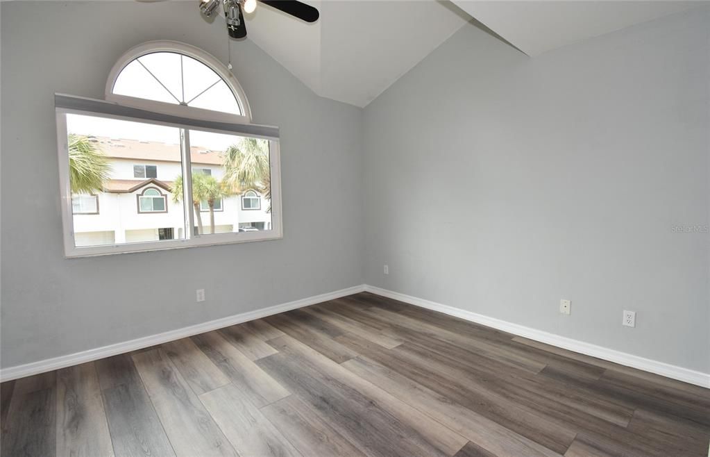 3rd bedroom accented by high ceilings