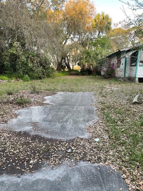 Left side of property standing on road