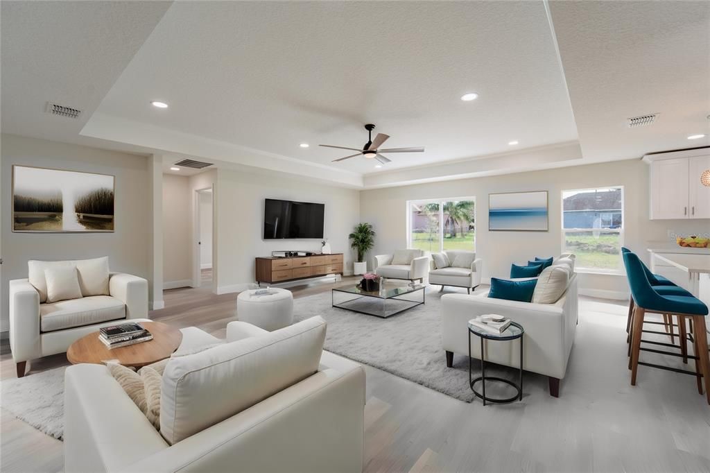 OPEN FLOOR PLAN WITH TALL TRAY CEILINGS.