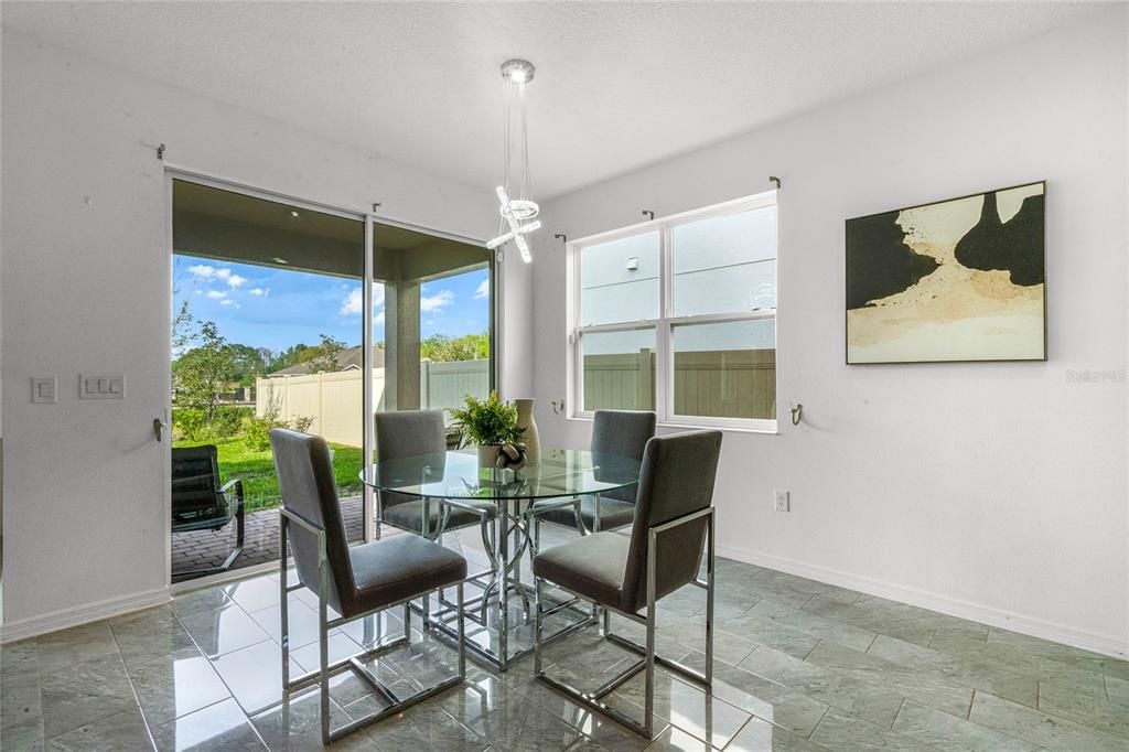 Sliding glass doors from the dinette area open up to a covered lanai.