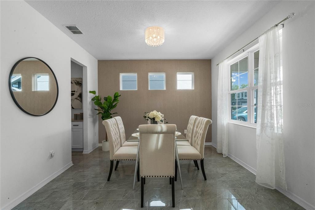 To your immediate right is an elegant formal dining room.