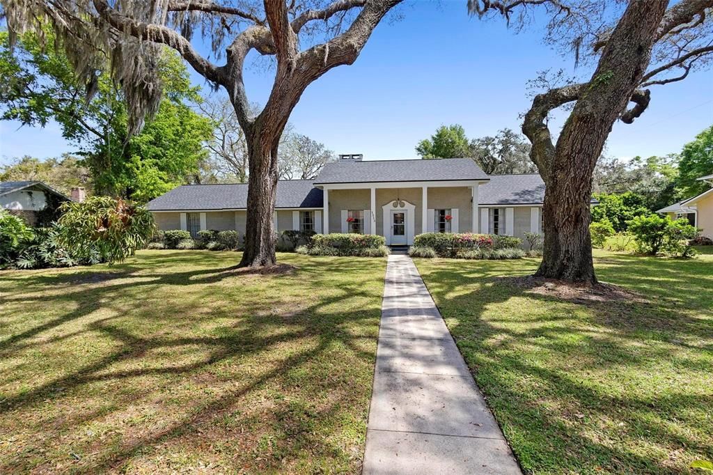 Large front yard and mature trees