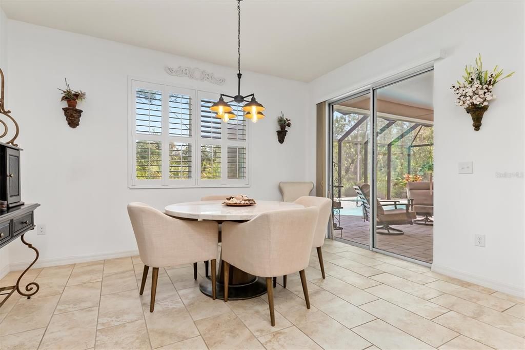 Breakfast nook (or dining room) leads to leisure and relaxation around your heated salt-water pool.