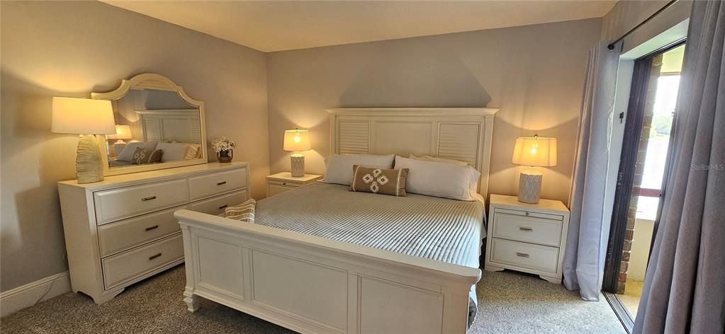 King size bed with ample drawers and a large closet