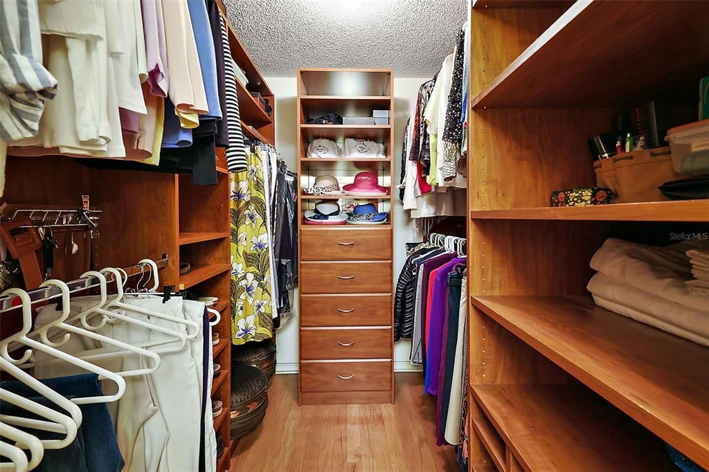 primary walk in closet with built ins
