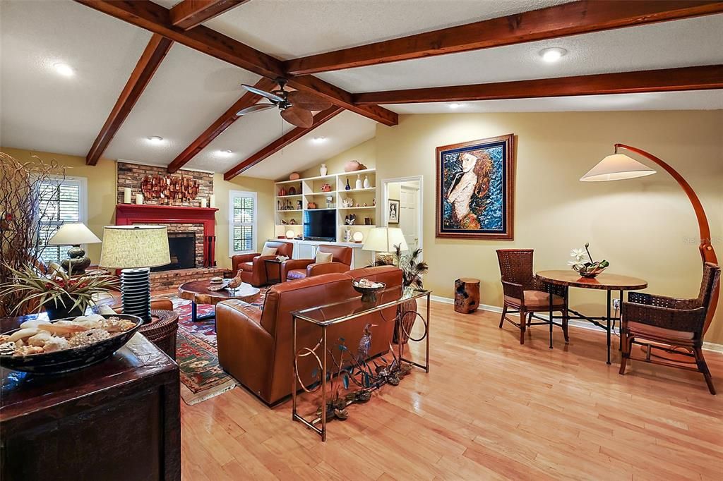 handsome wood beams accentuate the vaulted ceiling in the family room