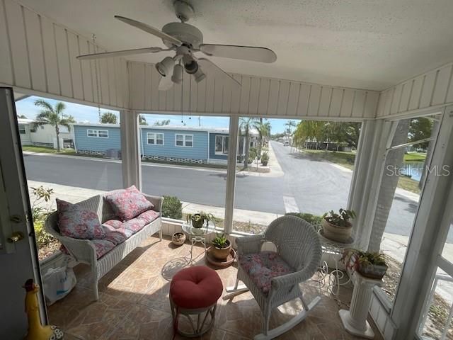 Lovely Serene Screened in front porch with view of lake with fountain!