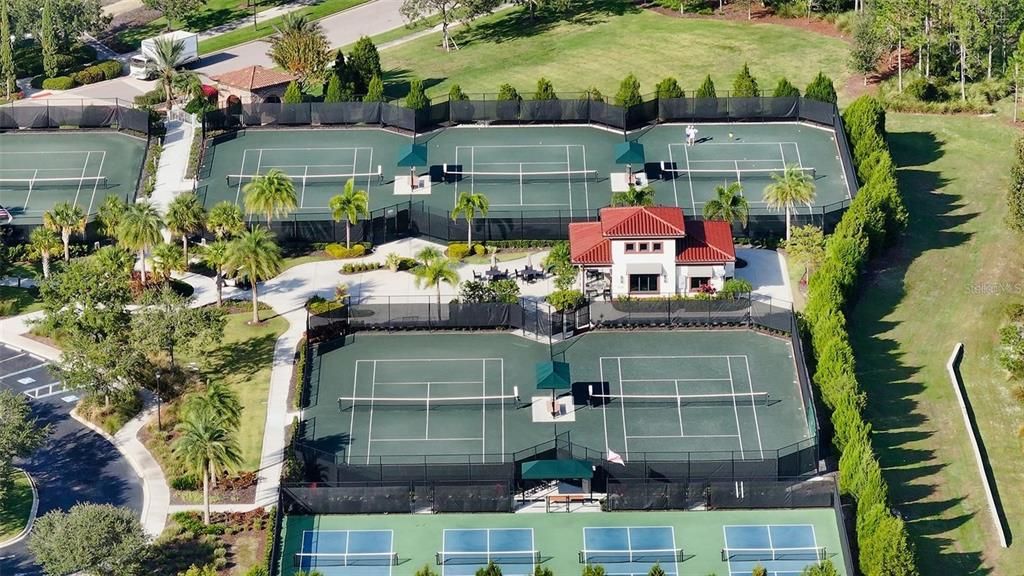 A birds eye view of the tennis courts and some pickleball courts