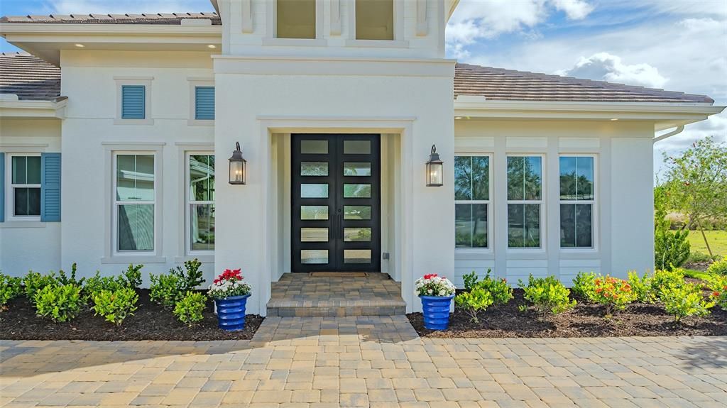 Magnificent Custom 10-foot Iron Doors (impact rated) to greet all who enter your home!