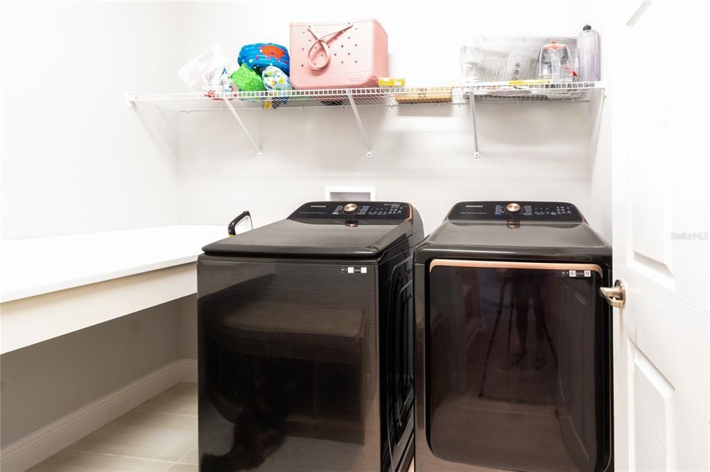 Laundry room with solid storage