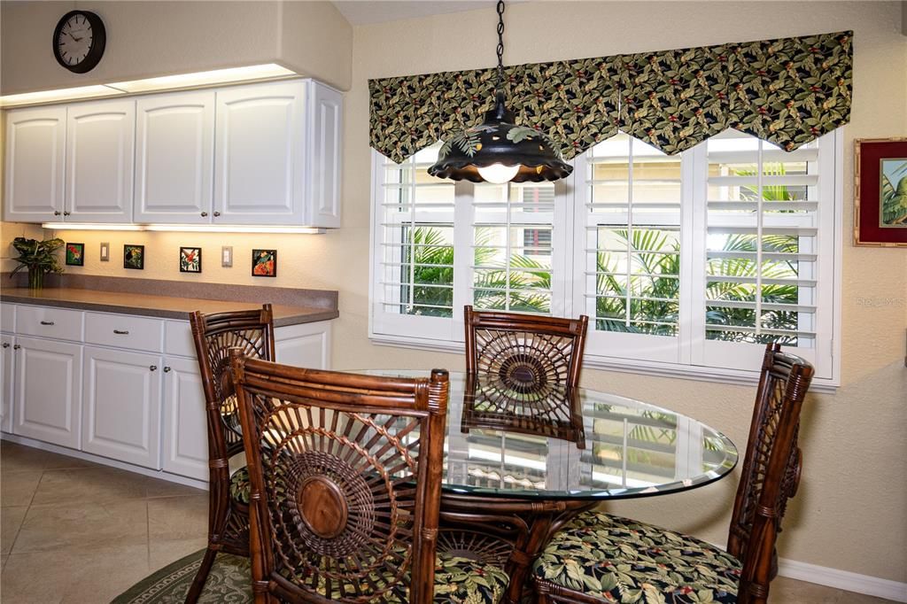A large window in the breakfast area brightens the space. Whole house Plantation shutters.