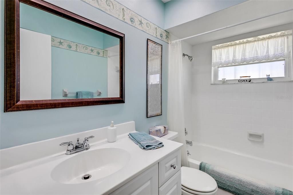 The Main Bath is located in the hall leading to the bedrooms. Combination tub/shower. Nicely appointed with solid surface counter sink and upgraded vanity.