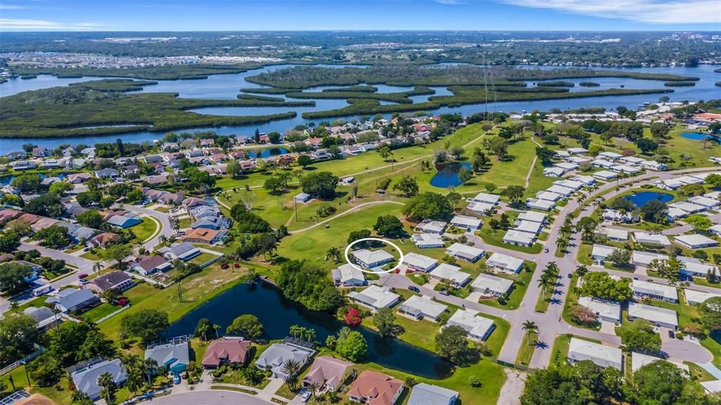 The property is on the last cul-de-sac to the back of the community. The road to the right of center is the main boulevard for access and egress. The Braden River is in the background. The community is on the river.