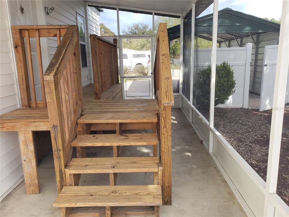 Steps to backyard from screened porch