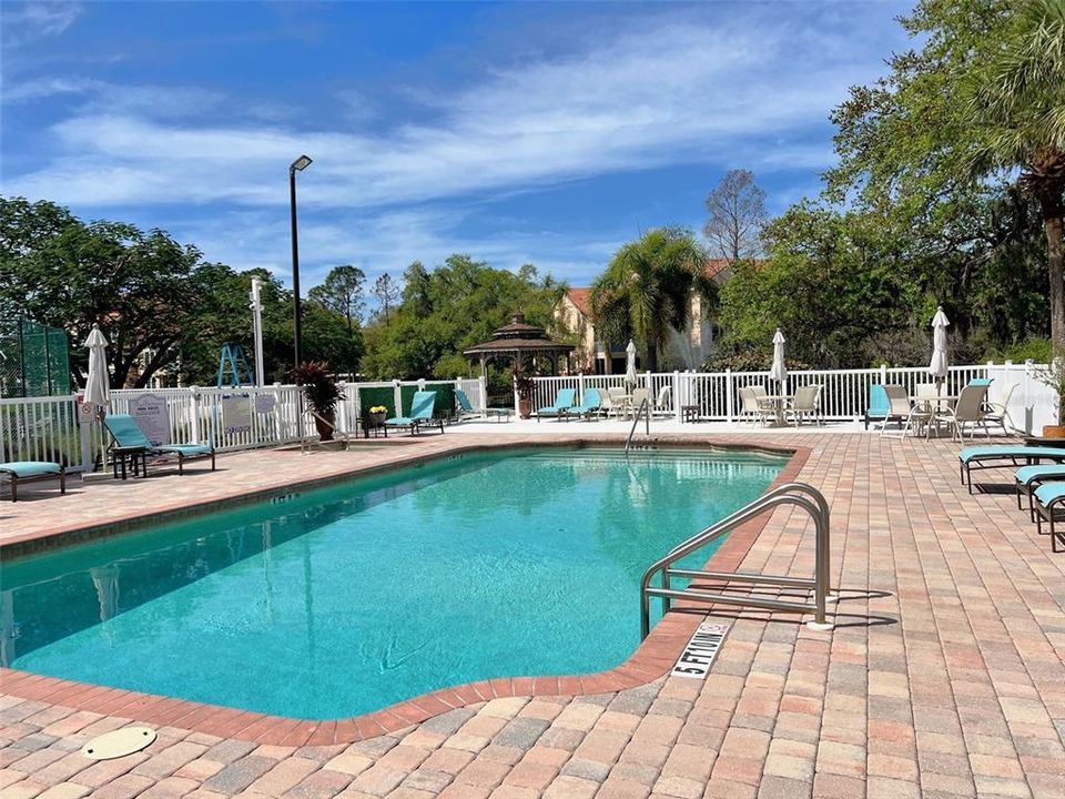 Amenities include a heated pool & spa, tennis courts, clubhouse and fitness center.