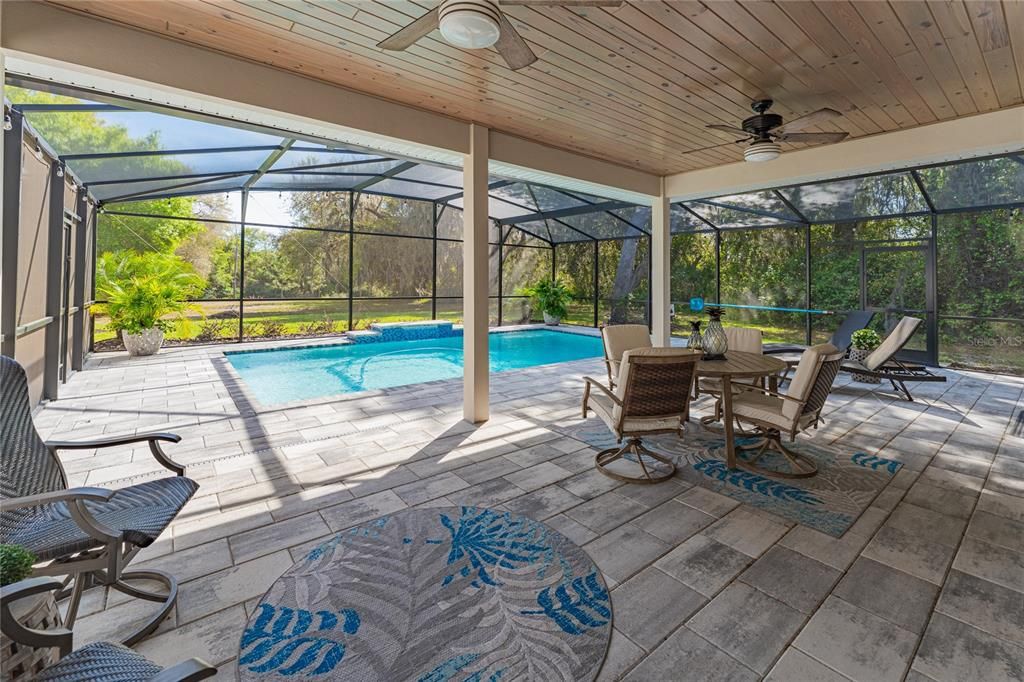 covered and screened-in patio and salt-water pool