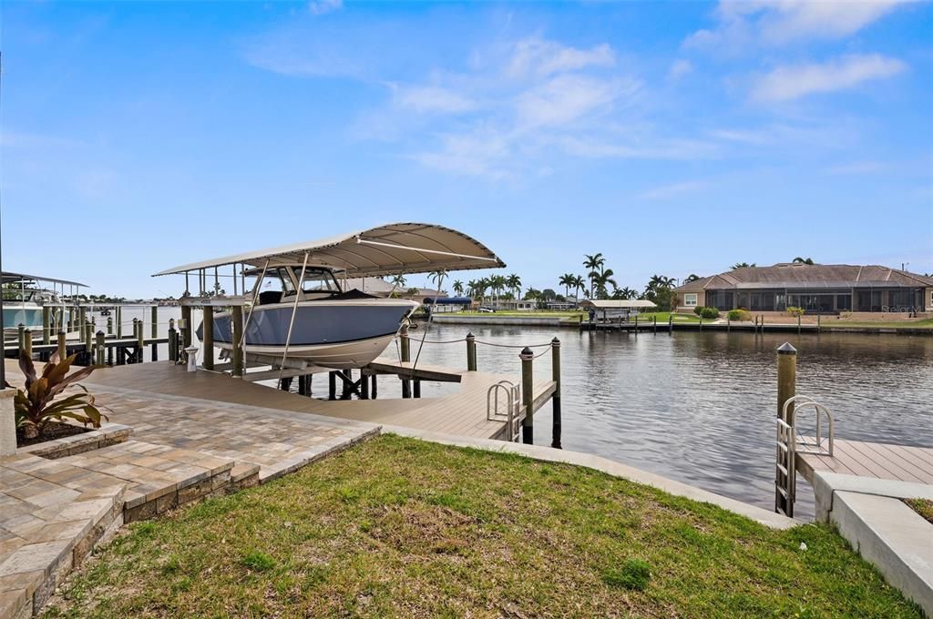 Patio Pavers, Huge Dock and 24,000Lbs Boat Lift and Canopy ( Boat Sold Separately)