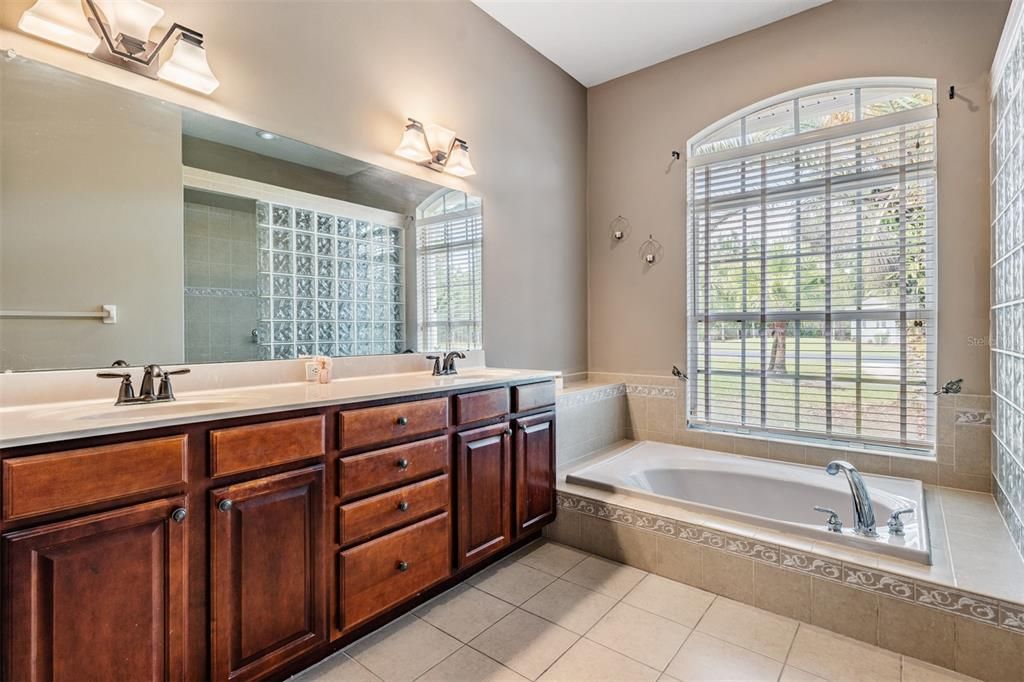 Bath ensuite with soaking tub and separate shower