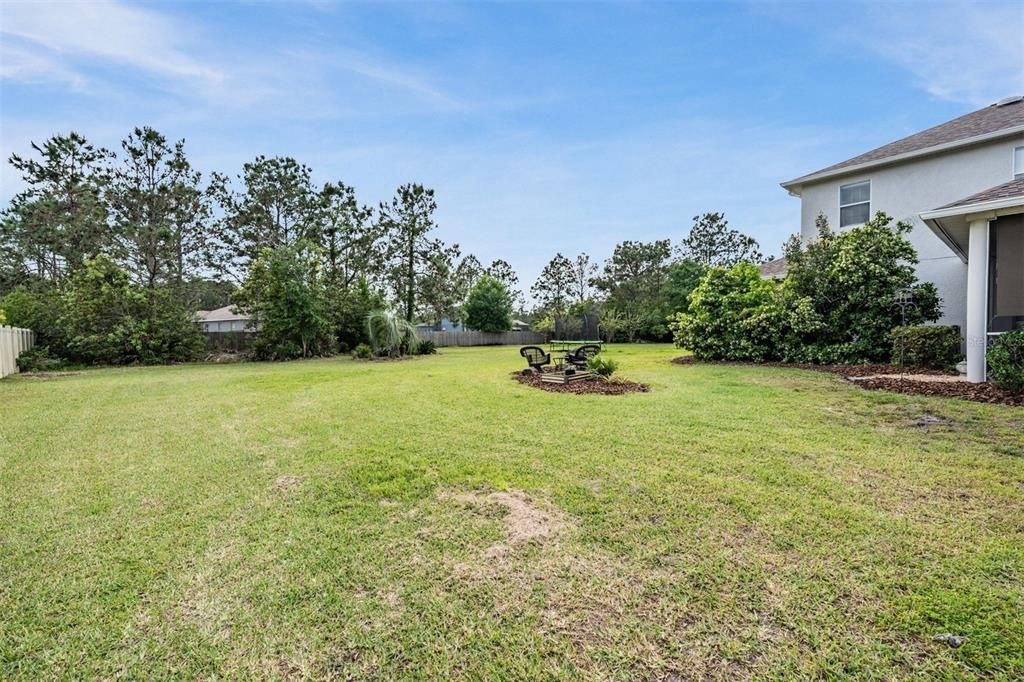 Firepit and room to spread out in the oversized yard