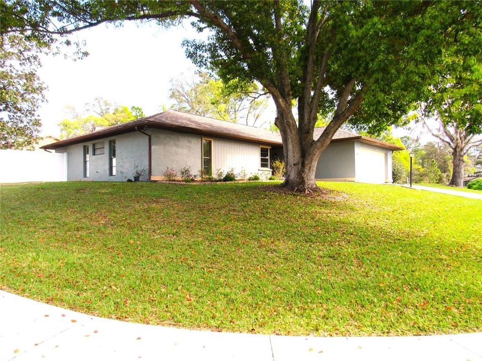 Side Walks and Large Drive Way Lead Up To This Charming Home!