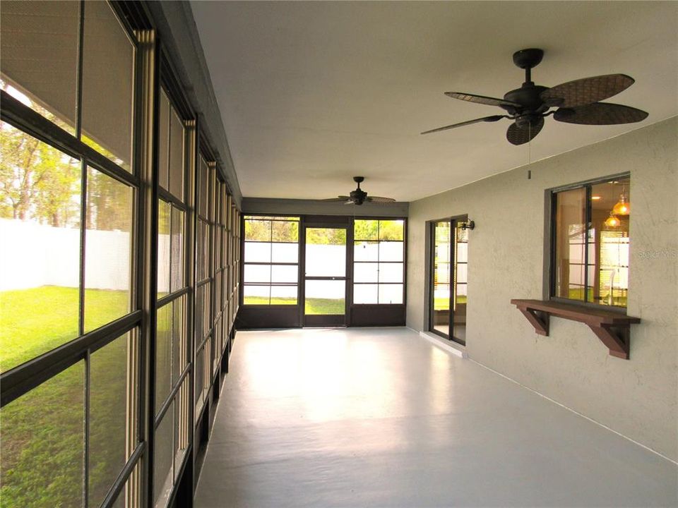 Glass Sliding Doors Open From Great Room To Lanai.