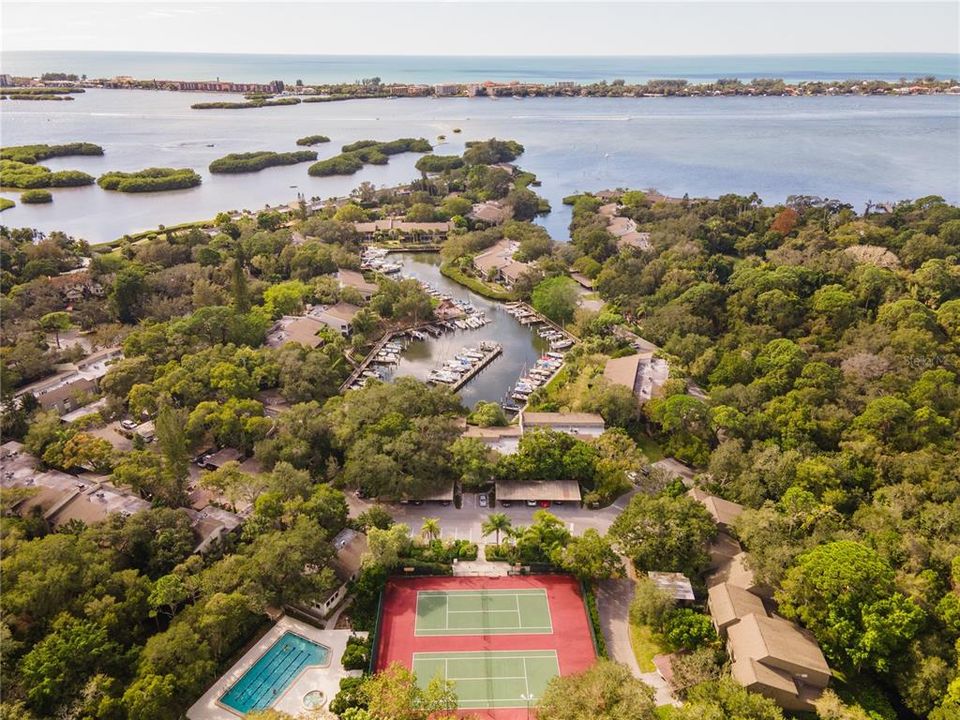 Overview of tennis courts, lap pool and 87 slip harbor