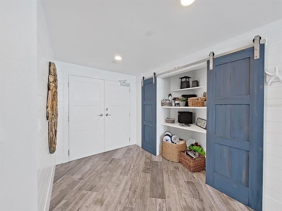 Entrance with build in feature and barn doors
