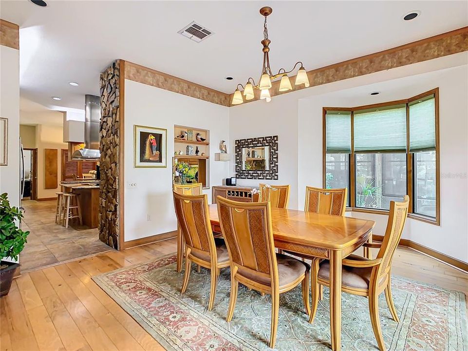 Formal dining room opens to the gourmet kitchen.