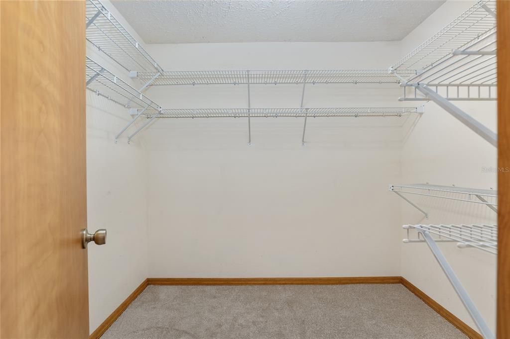 SPACIOUS WALK-IN CLOSET WITH BUILT-IN SHELVING