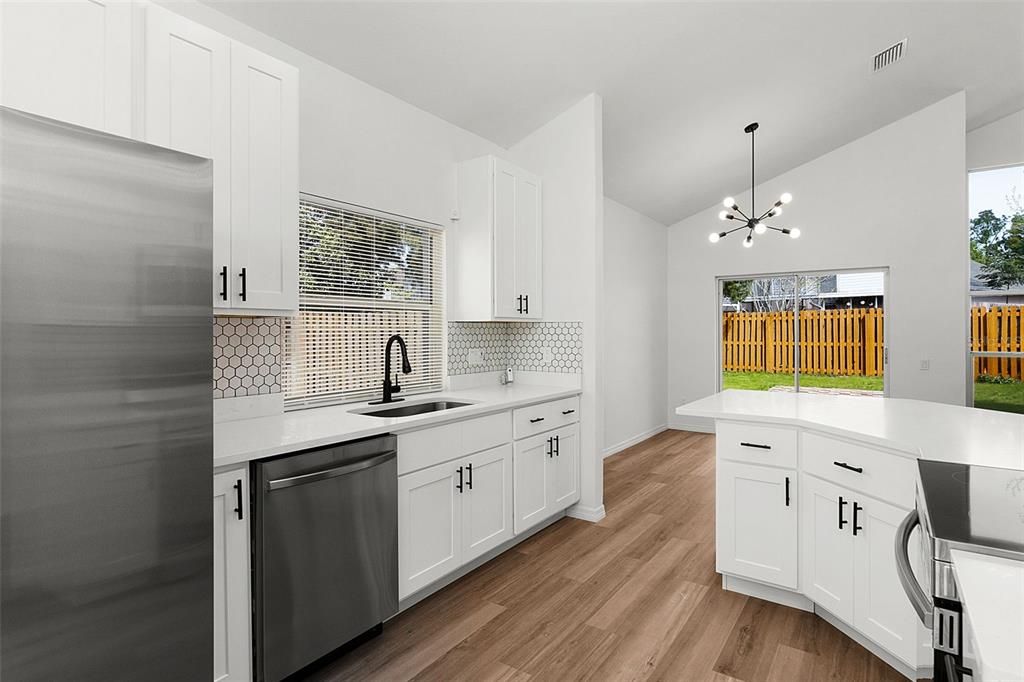 Fully Remodeled KITCHEN with QUARTZ COUNTERTOPS, 42" upper CABINETS, modern HEXAGON TILE BACKSPLASH and Premium Samsung SS Appliances