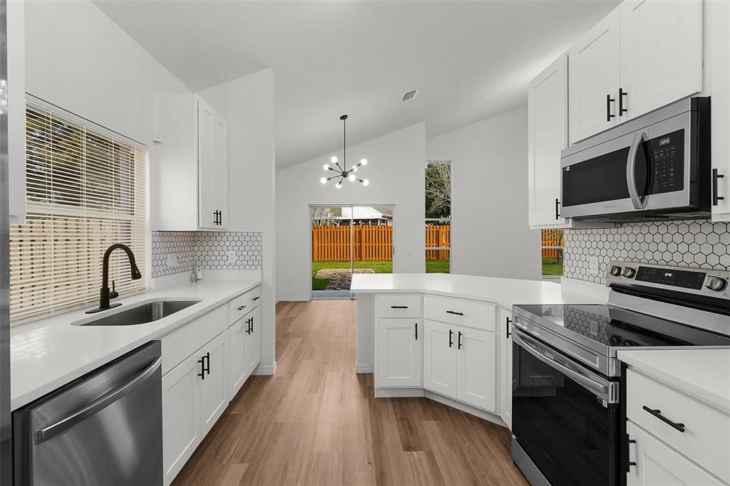 Fully Remodeled KITCHEN with QUARTZ COUNTERTOPS, 42" upper CABINETS, modern HEXAGON TILE BACKSPLASH and Premium Samsung SS Appliances