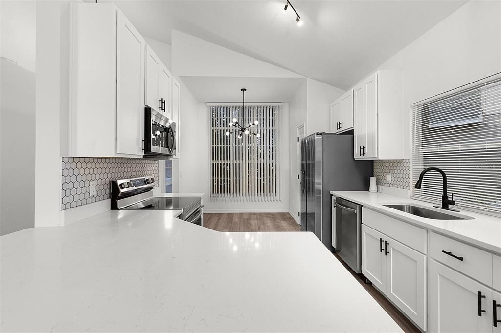 Fully Remodeled KITCHEN with QUARTZ COUNTERTOPS, 42" upper CABINETS, modern HEXAGON TILE BACKSPLASH and Premium Samsung SS Appliances