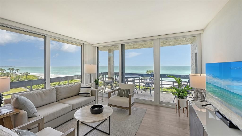 Turnkey furnished and expertly renovated premium 3rd floor, corner unit located directly on Longboat Key Beach