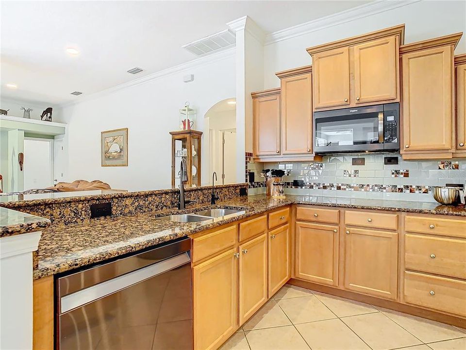 Gourmet top of the line kitchen Many cabinets and some have pull ot shelving appliances, gas range!  Granite counter tops