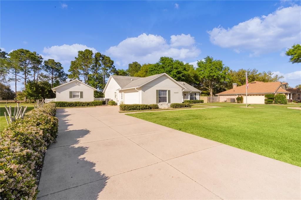 Long driveway with side-facing, double garage