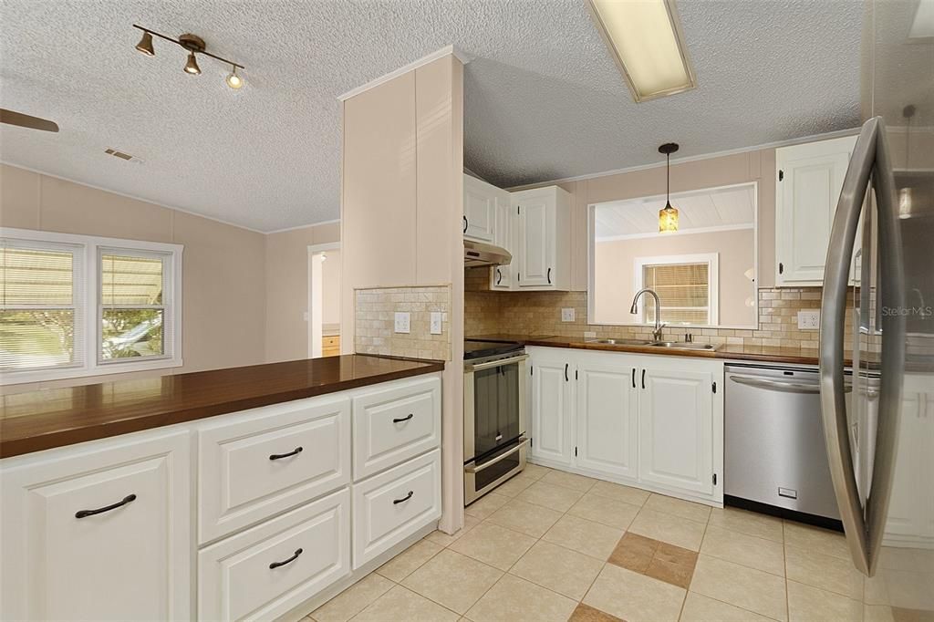 Kitchen with openings into the flex room and living room